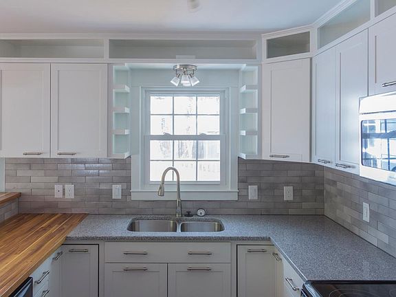 Custom cabinetry shelving and tile craft