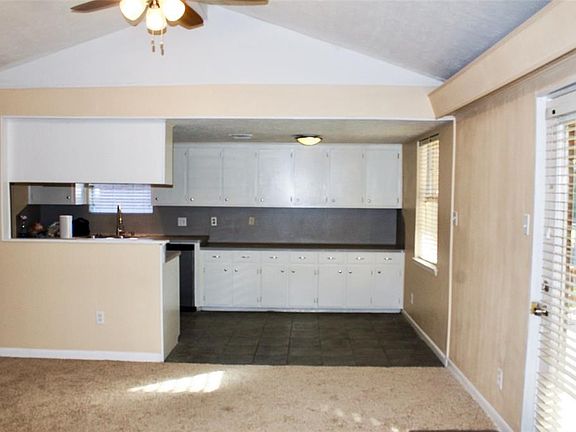 Kitchen brand new appliances,  new paint, built in buffet in breakfast area. The kitchen flows into to the living room.  As well as access to the dinning room.