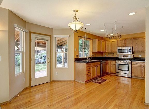 Delightful kitchen nook area fits dinette table if desired. Shi