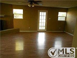 Second living room with cozy wood burning fireplace.