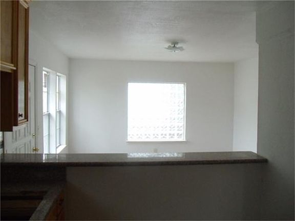a view to dinning room from ktichen notice the granite counter/breakfast bar