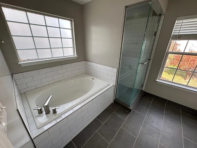 Master Bathroom tub and fully renovated glass shower