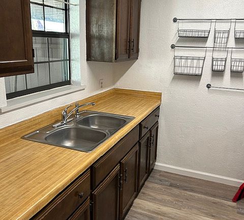 galley kitchen with gas stove and fridge