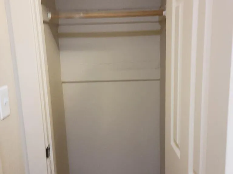 Closet with door for clothes and personal belongings