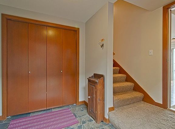 Large foyer on ground/garage level with heated tile flooring & e