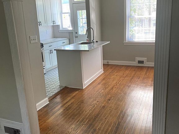 View from living room into kitchen and dining room