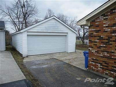 Two car detached garage in private backyard.  Digging in backyard is for new sewer line just installed.