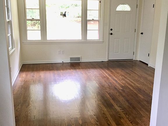 View from dining area to front door - abundance of natural lighting throughout house