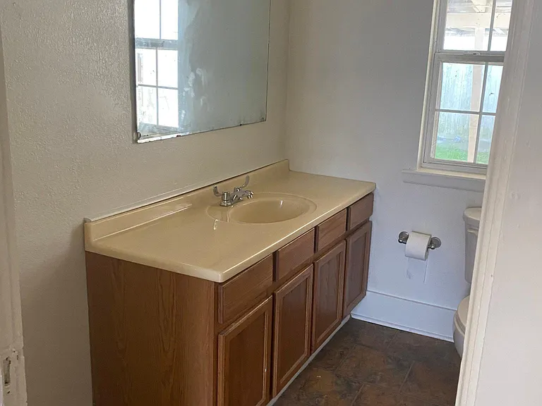 Updates coming: Cabinet being painted white, granite countertops, new white mirror, new flooring