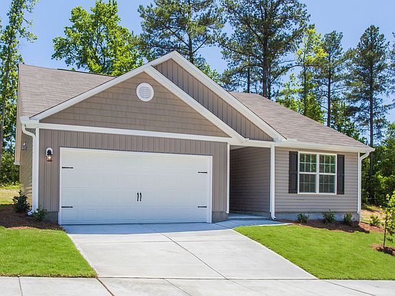 Professionally landscaped yard fully finished garage