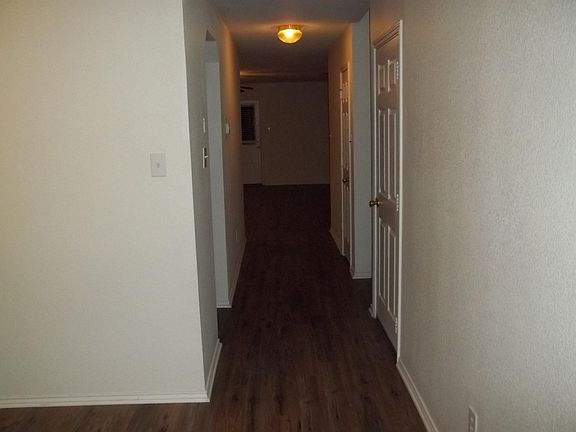 Hallway from entry to Garage, Kitchen, stair case, hall closet, Family Room