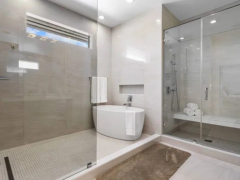 Step into pure bliss_this master bath is a sanctuary of luxury with exquisite stone details that make every moment feel like an escape.