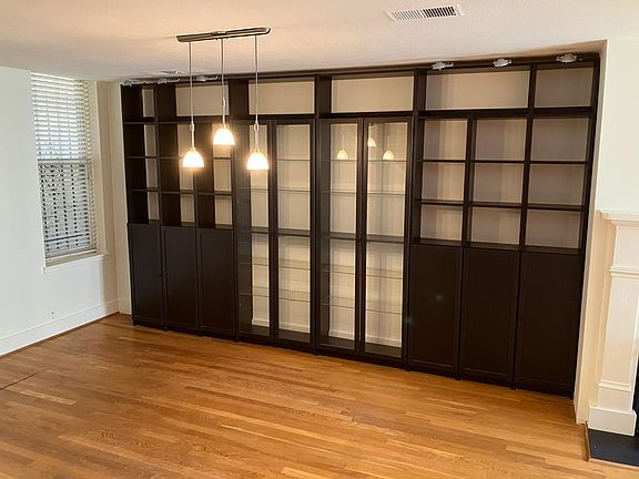 built in china cabinet and storage area in dining room.