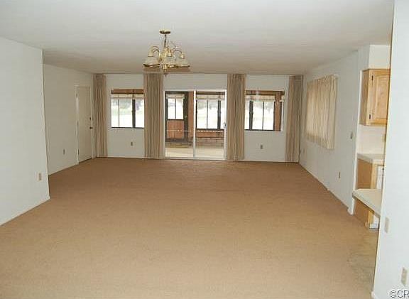 Vew from living room looking into dining room, family room and p