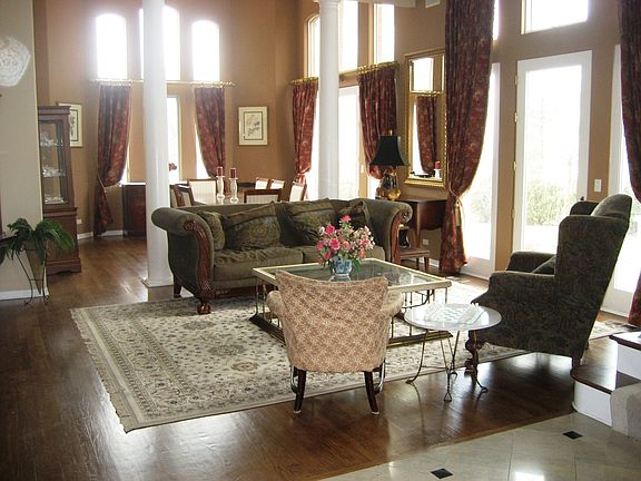 Dramatic 2 Story Living and Dining Rooms