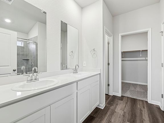 Unwind at the end of the day in the primary bathroom.