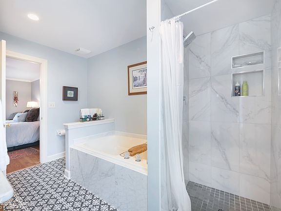 New Shower Door now installed and Shower curtain has been removed.