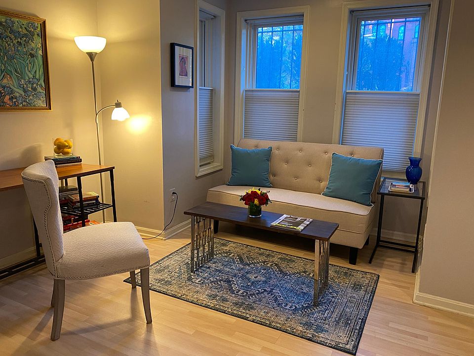 Sitting area in alcove with windows on 3 sides.