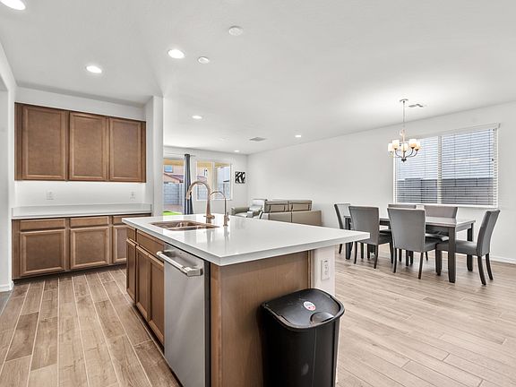 Open concept: kitchen, dining, living.