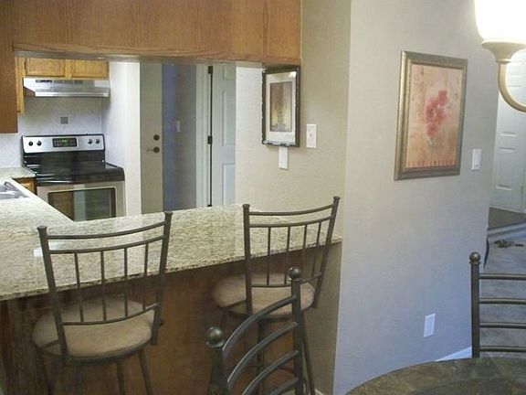 Breakfast bar with new Venetian Gold granite counter tops.