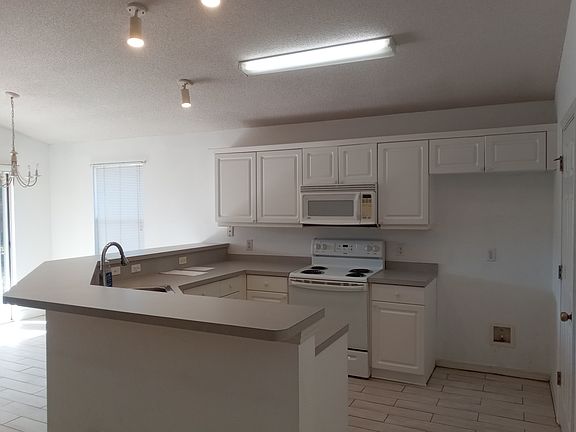 Lovely kitchen with an added refrigerator.