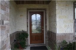 This Wall home has upgraded farmhouse elevation with stone and large front porch