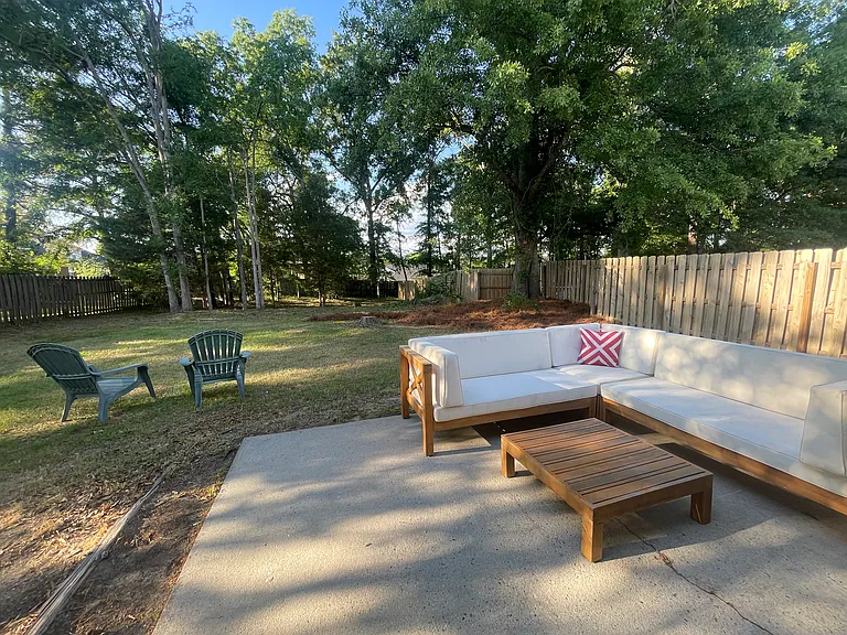 Comfortable and peaceful backyard with patio and patio furniture