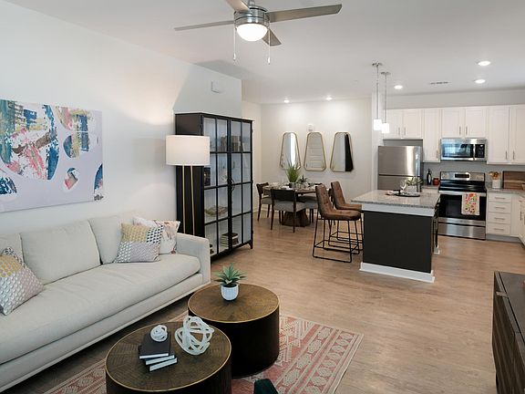 Elegant Wood Plank Flooring in Living Areas Enhancing the Cottage Feel