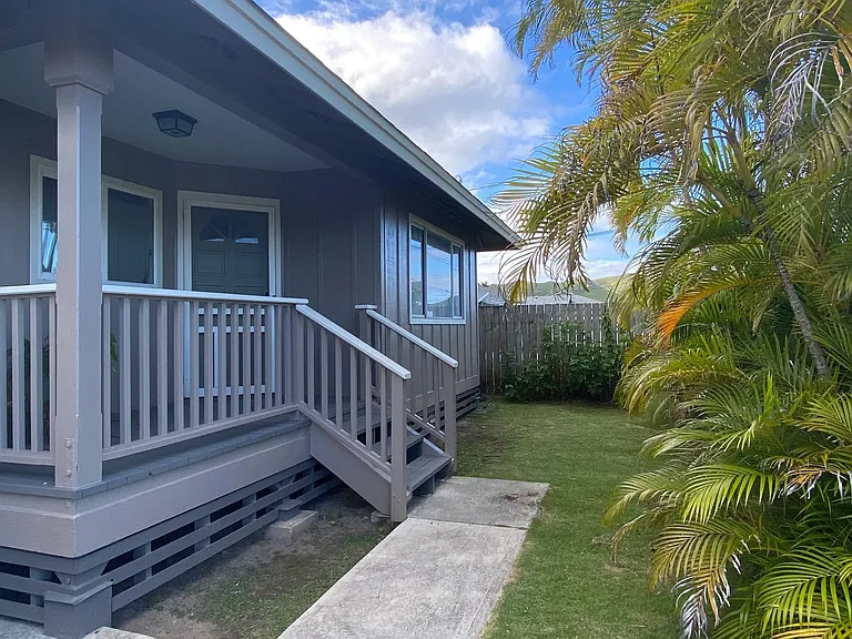 Font of the house. Palms provide privacy. Front yard is fenced.