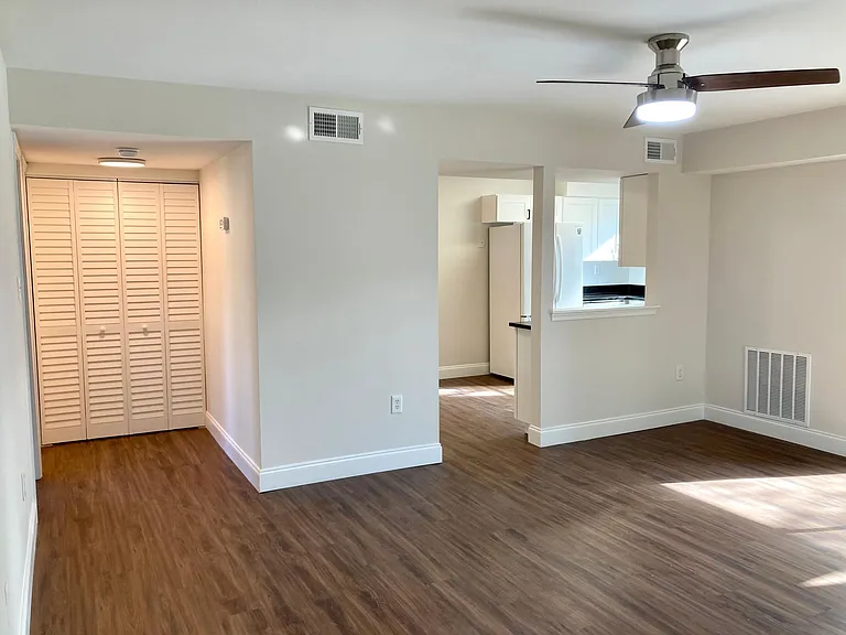 Large living room with breakfast bar into kitchen / dining