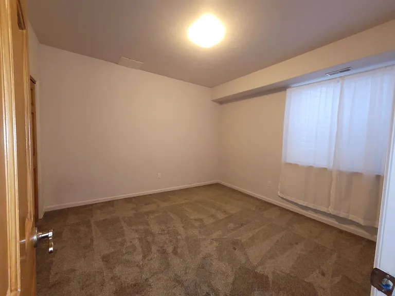Back bedroom with the sheers closed