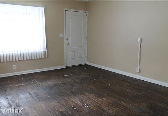 VIEW OF LIVING ROOM FROM DINING AREA IN KITCHEN