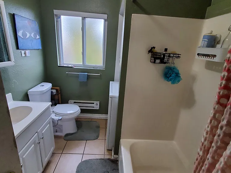 Bathroom includes stacked washer/dryer.
