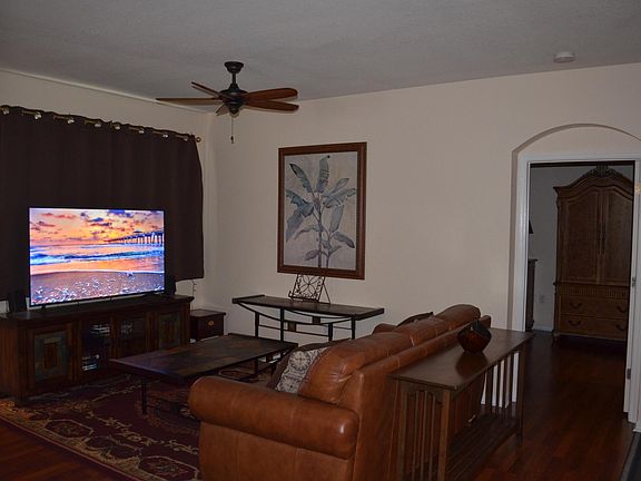 Leather pullout with foam mattress. 65" TV