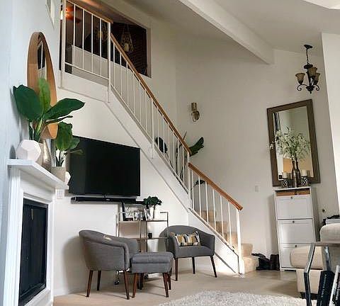 Living room area with gas fireplace, large bay windows, light, bright and spacious