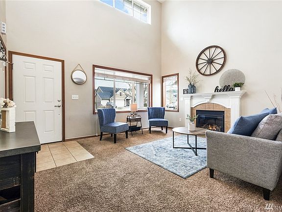 Note the upper windows - everything feels light and bright. Newer carpet here to enjoy as well!