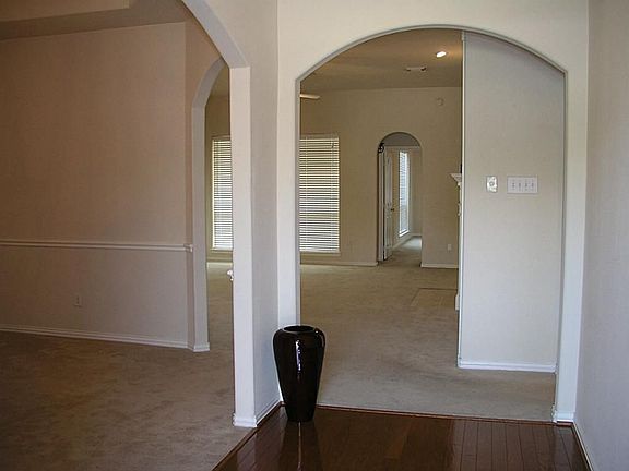 Arched entry ways and rounded corners adorn the house.