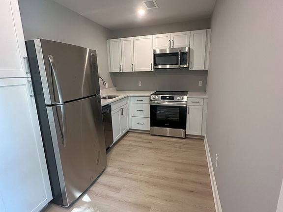 Kitchen with Range, Microwave and and Dishwasher