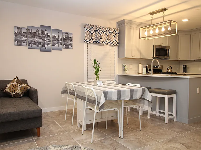 Dining area with seating space, perfect for family meals or entertaining.