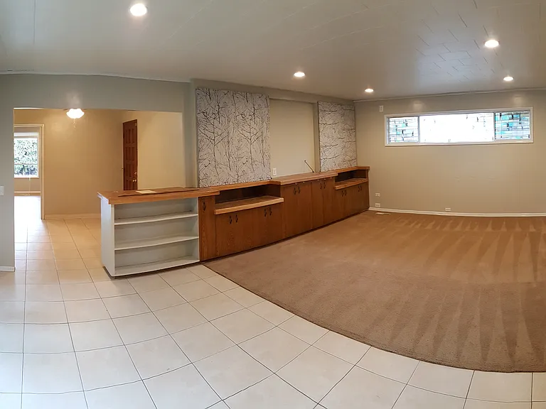 The back living/family room, dining room is large for family gatherings and the sliding glass door to the back yard.