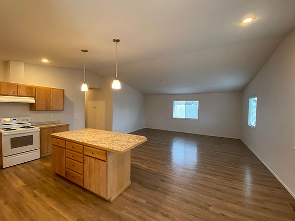 View of open floor plan with kitchen and living room
