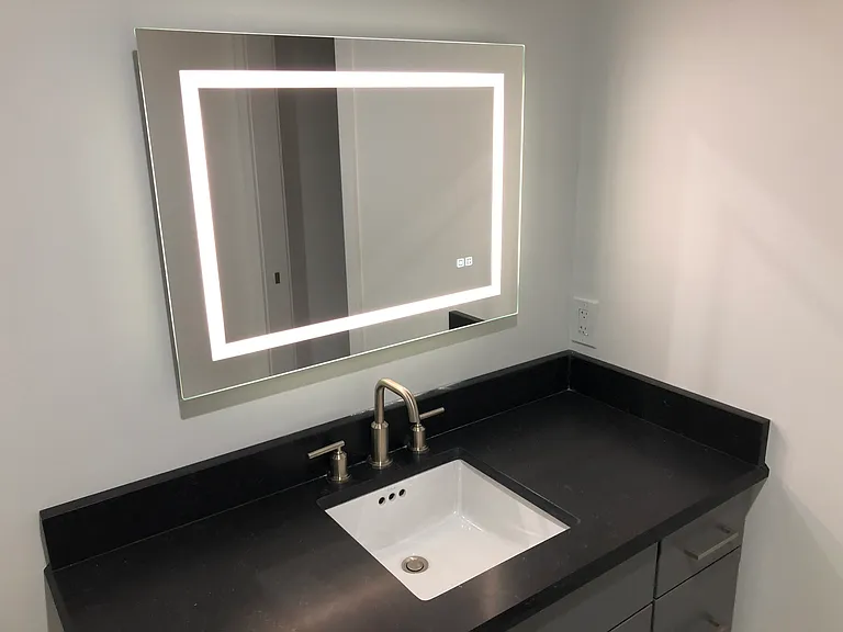 Lighted mirror & quartz countertop