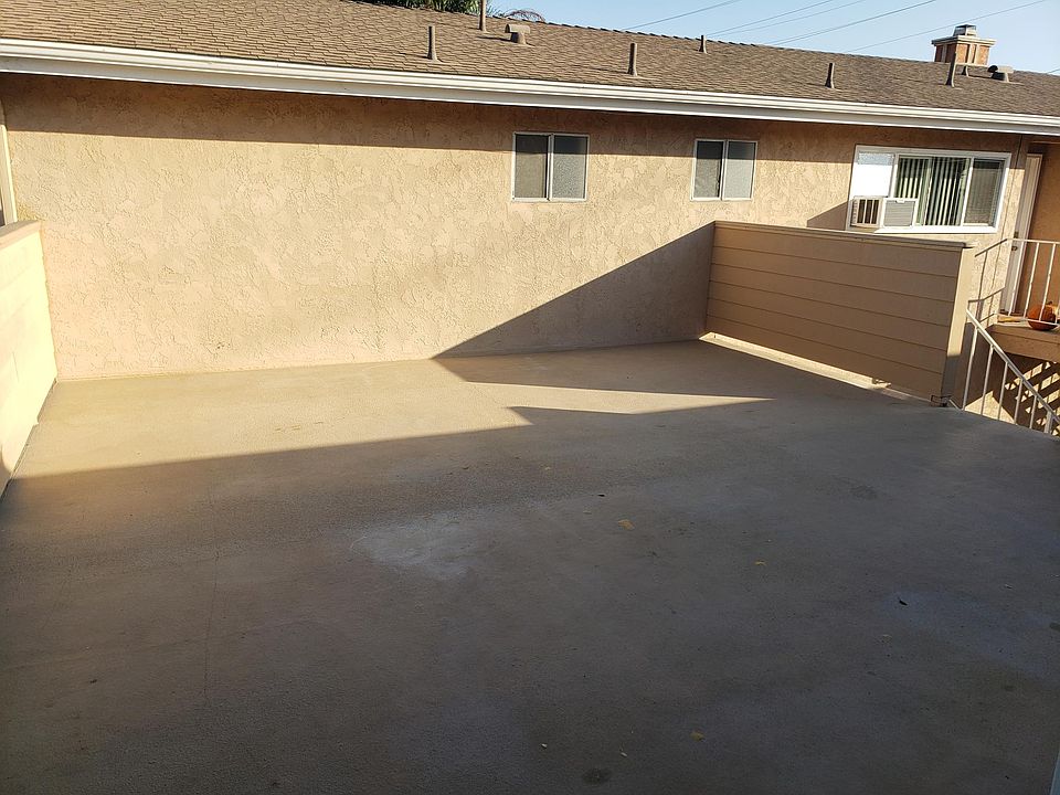 VIEW FROM KITCHEN ENTRY TO DECK ENTRY STAIRWELL TO THE RIGHT