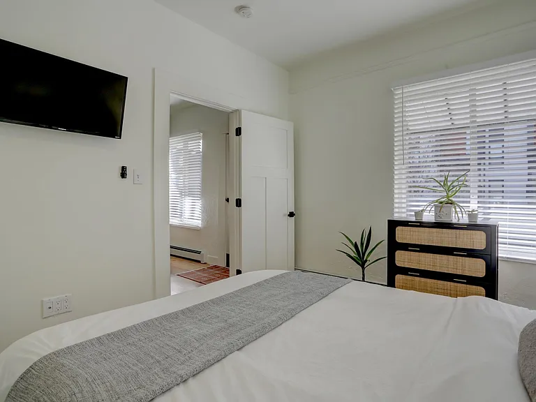 Front bedroom one second photo. Queen bed and smart tv