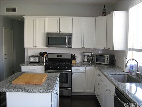 New cabinets, farm sink, granite counter tops, stove, microwave, dishwasher