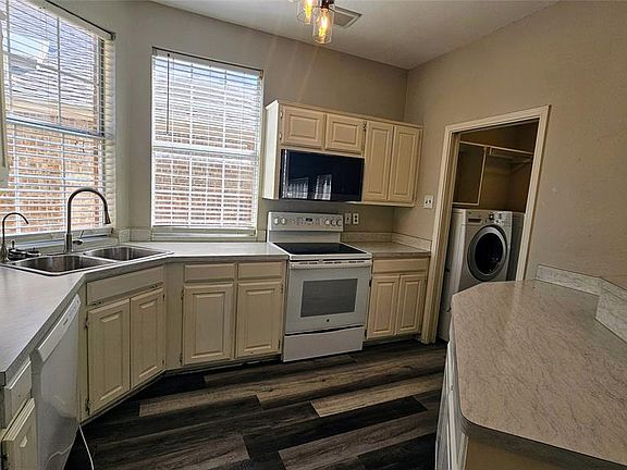 Breakfast bar and walk in utility with pantry shelves