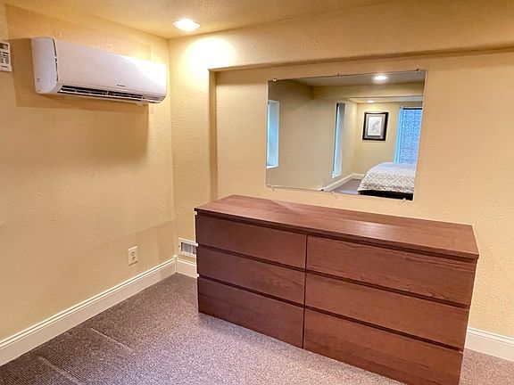 Large bedroom, dresser area, mini-split HVAC