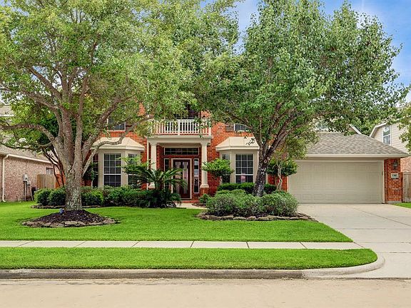 Mature landscaping with sprinkler system and 3 car tandem garage.