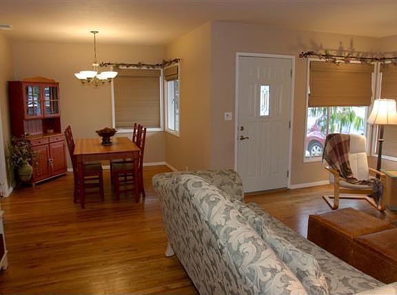 Open floorplan Formal Dining & Living Room Area with Hardwood Floors