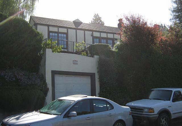 Street view of portion of house and one-car garage for mid/size car
(garage not recommended for storage of personal items).